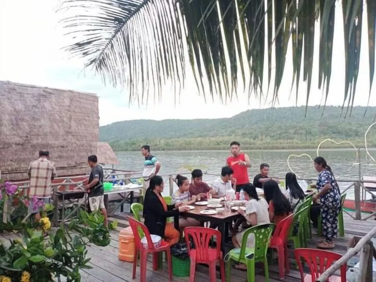 Family-style riverside meal