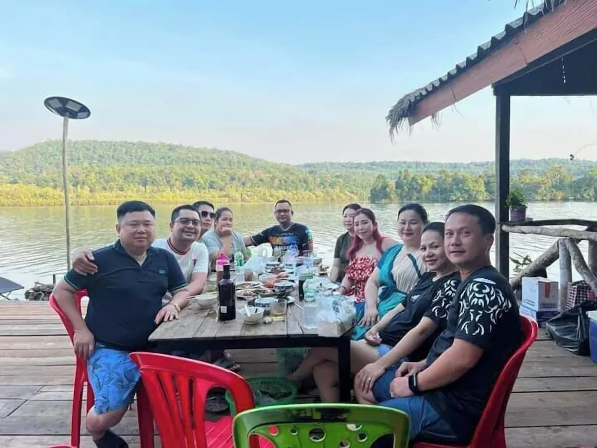 Group meal by the river