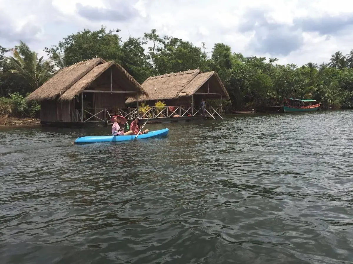 Kayaking by the floating bungalows